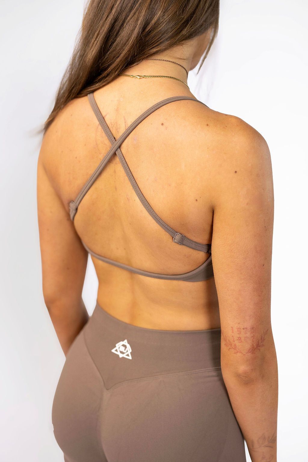 Coffee Sculpt Talia Crop rear angle featuring customizable multi-way strap system

